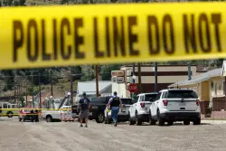 Manhunt launched after 4 killed in a shooting at a Montana bar