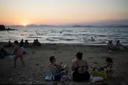 Beach on a budget: Greeks settle for day trips, priced out of iconic destinations